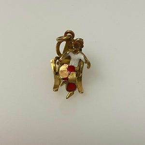 Vintage 14k yellow gold figure of man on a rocking chair charm