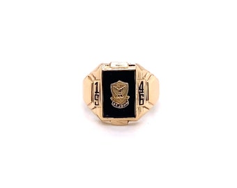 May include: A gold class ring with a black onyx stone featuring a crest with the words "St. John" and the years "1946" and "1951" engraved on the sides.