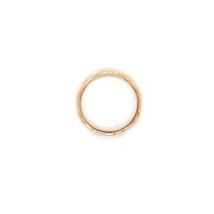 May include: A gold band ring with a textured surface.