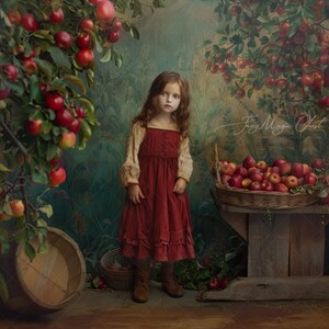 May include: A young girl in a red dress stands in front of a rustic backdrop with apple trees and a basket of apples. The girl is looking at the camera with a serious expression. The image has a vintage feel and is reminiscent of a fairytale.