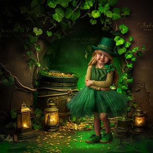 May include: A young girl wearing a green dress and hat stands in front of a green and brown backdrop. She is surrounded by gold coins and lanterns. The backdrop features a stone archway covered in green vines.
