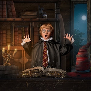 May include: A young boy dressed as a wizard with a surprised expression, wearing a black robe with a red and yellow striped tie, holding an open book with sparkling dust coming from it. The book is on a wooden table with a candlestick and books in the background.