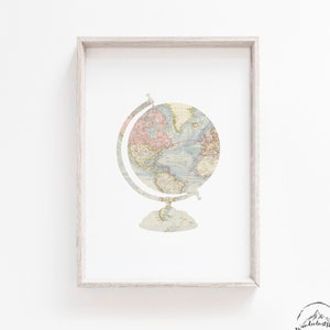 May include: A framed print of a vintage globe with a world map in muted colours, ideal for a nursery or playroom.