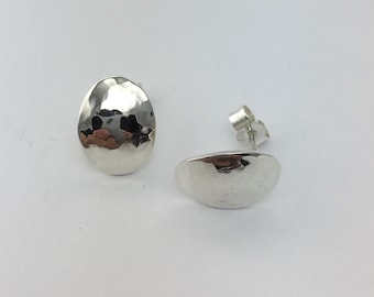 Handmade Sterling Silver curved oval shape stud earrings with a planished (hammered) finish.