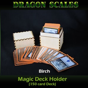 May include: A wooden box with a birch finish holds a deck of Magic: The Gathering cards. The box is labeled "Magic Deck Holder (150 card Deck)".