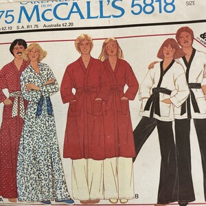 May include: A McCall's 5818 sewing pattern envelope for robes or jackets and pants. The illustration shows three variations: a long red patterned robe, a long blue floral robe, and a short white jacket with black trim paired with black pants.