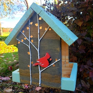 Handmade wood birdfeeder decorated to give life to your yard. Would also be a great gift!