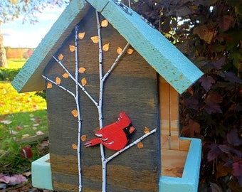 Handmade wood birdfeeder decorated to give life to your yard. Would also be a great gift!