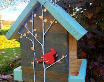 Handmade wood birdfeeder decorated to give life to your yard. Would also be a great gift!