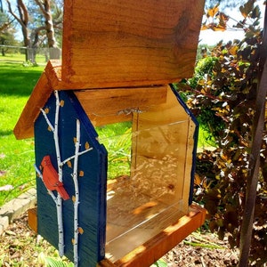 Beautiful handmade wood bird feeder, painted hunter green, or navy and a stained cedar color roof with hand painted accents. image 6