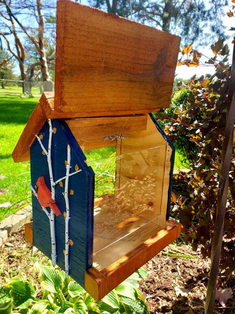 Beautiful handmade wood bird feeder, painted hunter green, or navy and a stained cedar color roof with hand painted accents. image 6