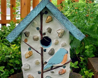 Handmade wood birdhouse with cement, stones, copper, and a handpainted bluebird.