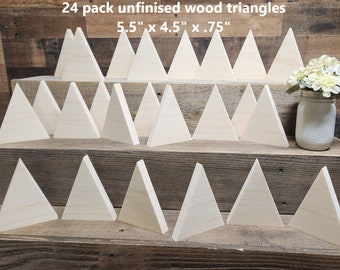 May include: 24 pack of unfinished wood triangles, each measuring 5.5 inches by 4.5 inches by 0.75 inches. The triangles are arranged in three rows on a wooden surface.
