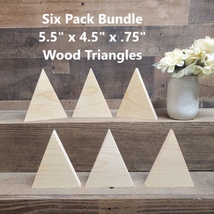 May include: Six pack bundle of six unfinished wood triangles, each measuring 5.5 inches by 4.5 inches by 0.75 inches. The triangles are arranged in two rows of three on a wooden surface.