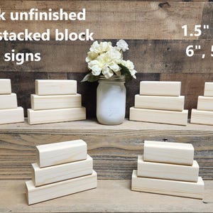 May include: Six unfinished wooden blocks stacked in three sets of two. Each block is 1.5 inches by 1.5 inches and the blocks are 6 inches, 5 inches, and 4 inches tall. The blocks are made of natural wood and have a smooth, unpainted surface.