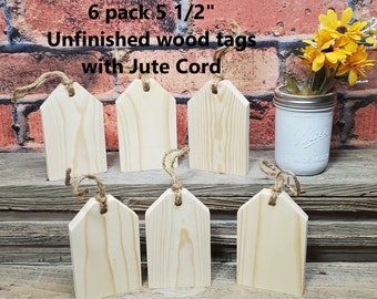 May include: Six unfinished wooden tags with jute cord, each measuring 5 1/2 inches. The tags are arranged in two rows on a wooden surface.