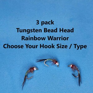 May include: Three Tungsten Bead Head Rainbow Warrior fishing flies on a blue background. The text reads "3 pack", "Choose Your Hook Size / Type". The flies have red, green, and black accents.
