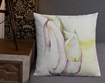May include: A watercolor painting of a pair of ballet shoes in pink and yellow hues on a white background.