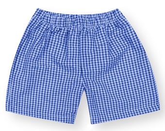 May include: Blue and white checkered shorts with an elastic waistband.