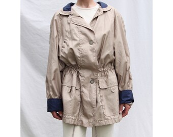 cinched waist raincoat