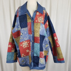 May include: A blue, red, green, and brown quilted jacket with a patchwork design and button closure.