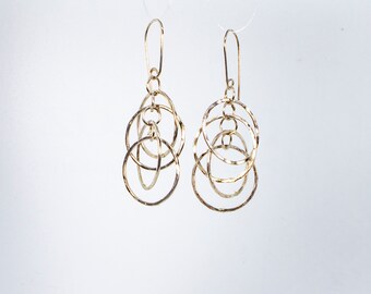 Earrings, drop, with four hammered dancing hoops in sterling silver