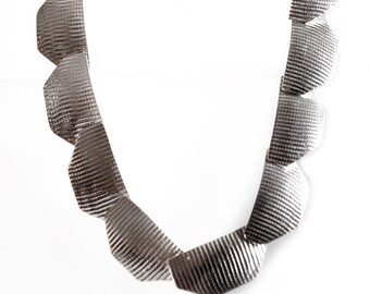 Necklace with moiré silk finish half octagons