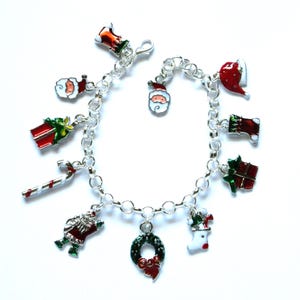 Christmas bracelet, 11 enameled and silver plated charms, adjusts 7&quot; to 8&quot;, 325