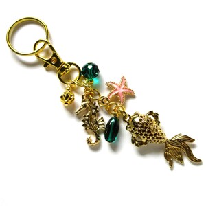 Golden goldfish keychain, 4 inches long with seahorse and starfish, 53