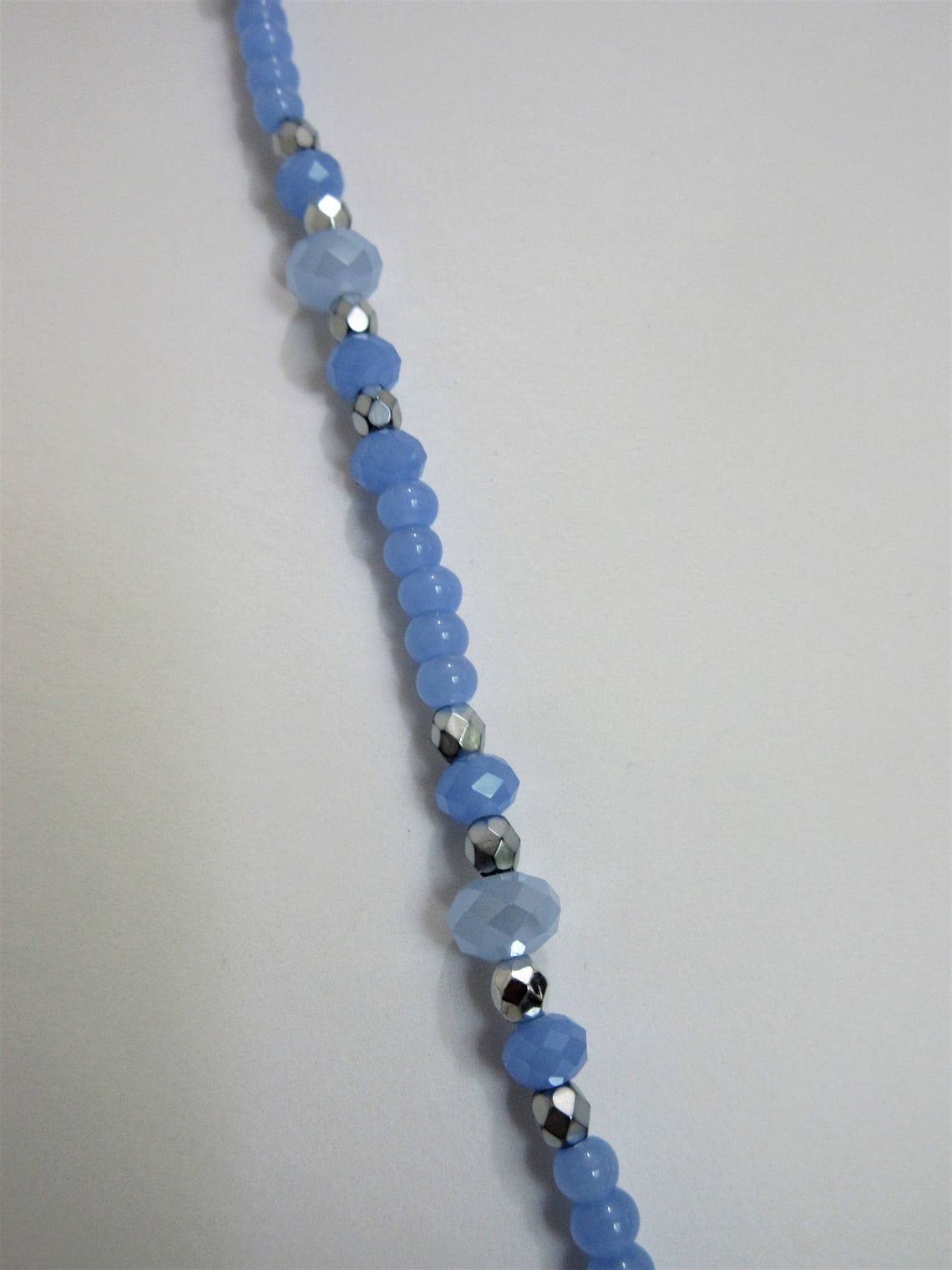 Baby blue necklace with silver swirled star pendant blue Etsy