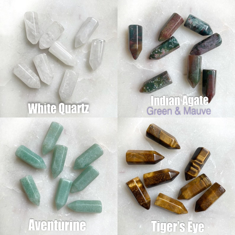 Four groups of polished, pointed crystals: white quartz, Indian agate green and mauve, aventurine, and tiger's eye.