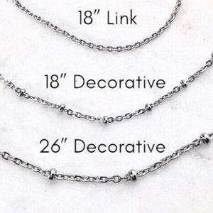 Three silver chains of different lengths, 18 inch link chain, 18 inch decorative chain, and 26 inch decorative chain.