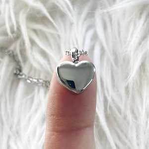 A Stainless Steel Heart Urn Necklace that is small, simple and comfortable. Find more beautiful, cremation urn jewelry here!