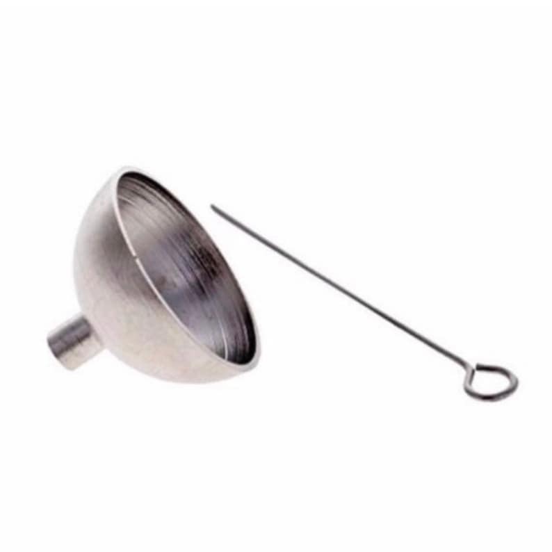 May include: A silver funnel with a long, thin, silver rod with a loop at the end. The funnel is designed for filling small containers.