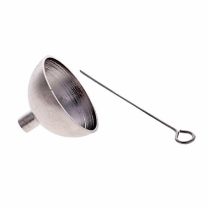 A small funnel for cremation jewelry.