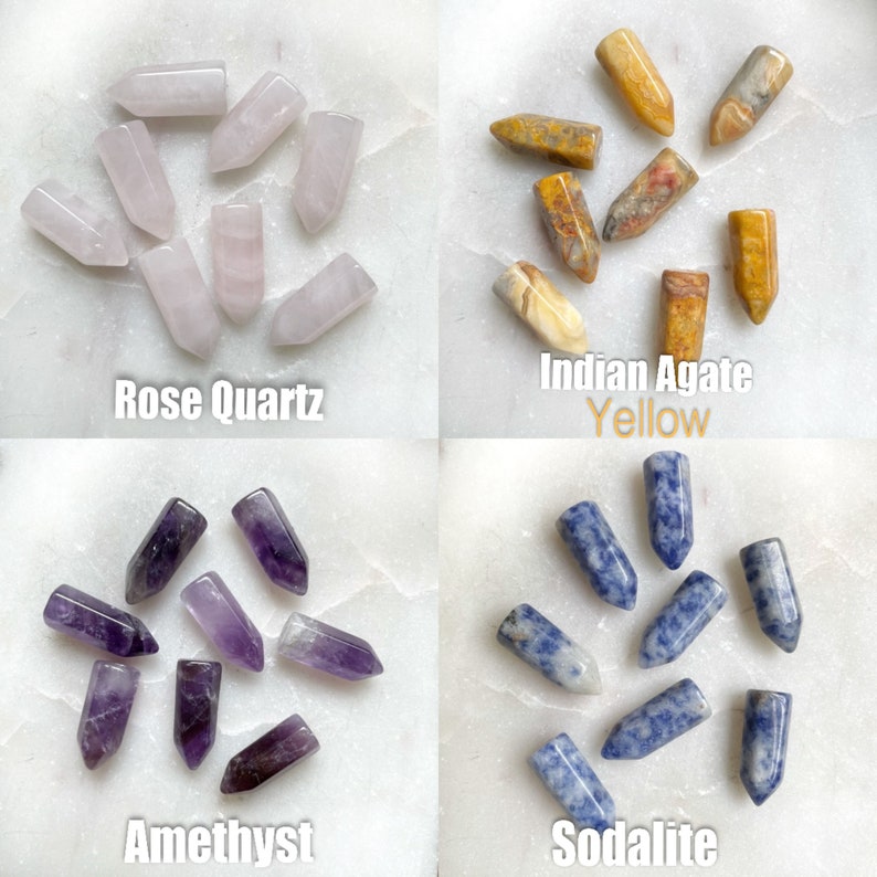 Four sets of polished gemstone points. The top left set is rose quartz points in light pink. The top right set is Indian agate points in yellow, brown, and white. The bottom left set is amethyst points in purple. The bottom right set is sodalite points in blue.