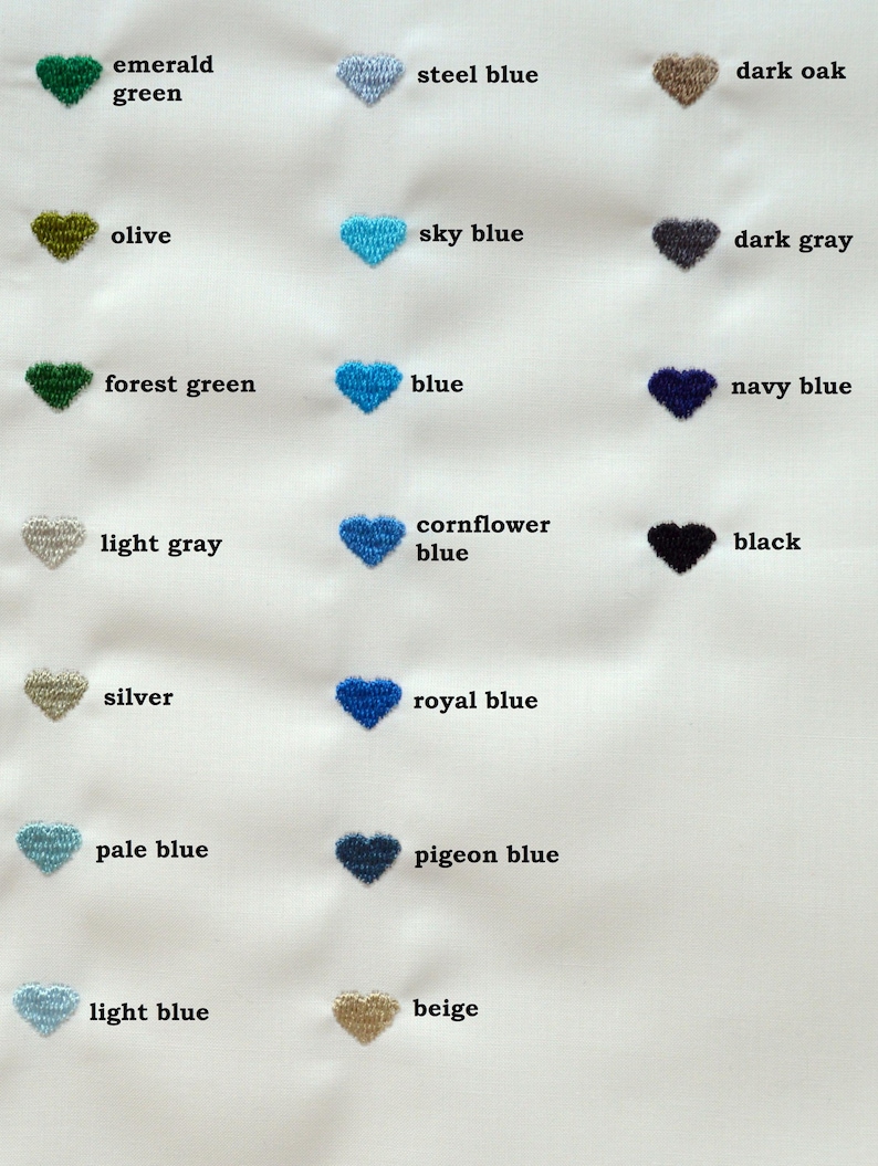 May include: A fabric swatch featuring embroidered heart shapes in various colors, including emerald green, steel blue, and dark oak. Each heart is labeled with its corresponding color name, such as "sky blue" and "navy blue."