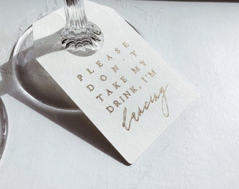 Don't take my drink glass tag / I'm dancing drink tag / gold dancing tag
