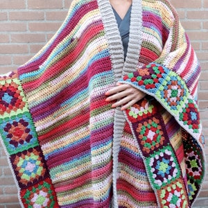 May include: A colourful striped crochet poncho with a granny square border. The poncho is made with a variety of colours, including red, blue, green, and yellow. The granny square border is made with a white yarn.