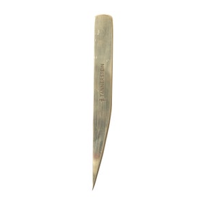 May include: A close-up of a silver metal tweezers with a pointed tip. The tweezers have the text "#TANNERS TEIN" engraved on the side.