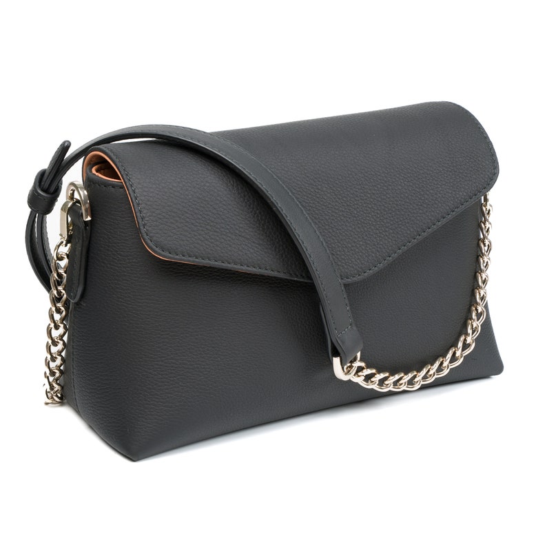 PEGAI Helen Black Pebbled Calfskin Leather Handbag featuring a sleek crossbody design, adjustable metal and leather strap, gold-plated hardware, and a secure magnetic closure. Perfect for a luxurious and stylish look.