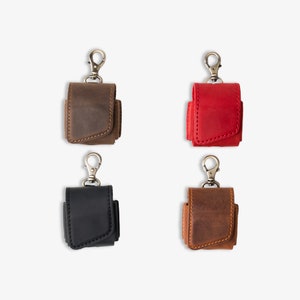 Hand-stitched AirPods cases in earthy tones, designed for functional gifting, daily tech storage, or office style.