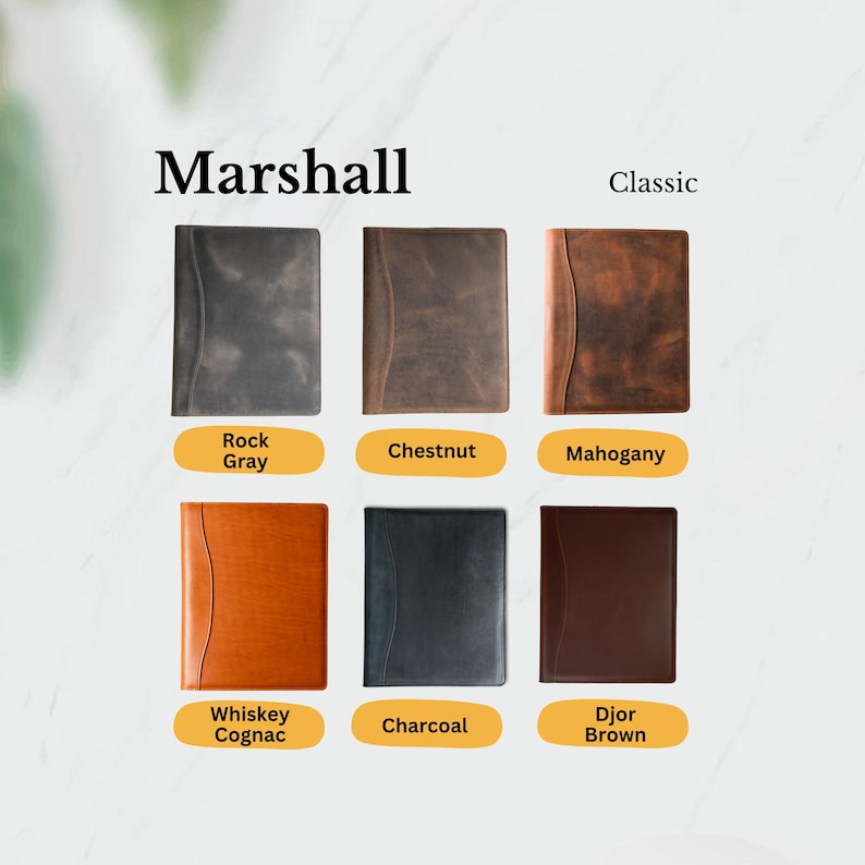 A lineup of Marshall Classic leather folios in Rock Gray, Chestnut, Mahogany, Whiskey Cognac, Charcoal, and Djor Brown—perfect for gifting or everyday hustle.