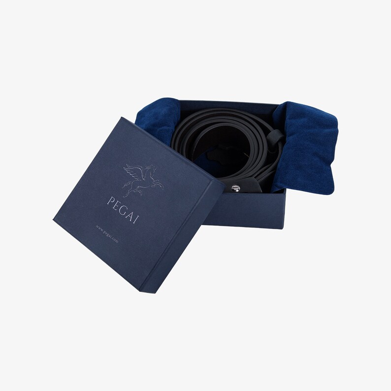 May include: A black leather belt rolled up in a blue box with a white Pegasus logo and the text "PEGAI" and "www.pegali.com".
