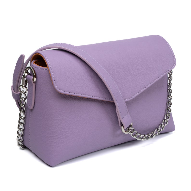 PEGAI Helen Lilac Pebbled Calfskin Leather Handbag featuring a sleek crossbody design, adjustable metal and leather strap, nickel-plated hardware, and a secure magnetic closure. Perfect for a luxurious and stylish look.