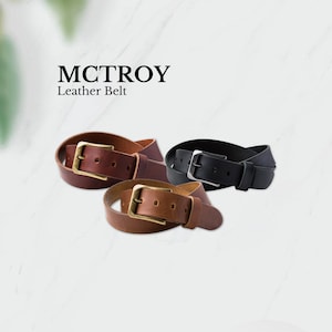 May include: Three leather belts with brass buckles. The belts are brown, black, and a lighter brown. The belts are arranged in a circle with the buckles facing out.
