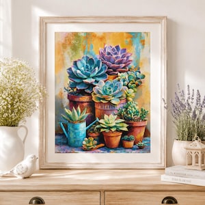 May include: A framed wall art print depicting a vibrant painting of various succulents in terracotta pots and a blue watering can. The artwork features a colourful, textured background with shades of yellow, orange, and blue behind the plants.