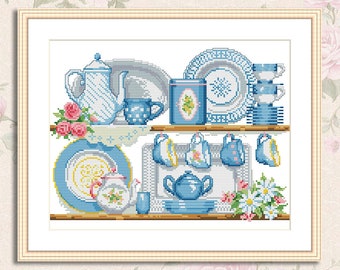 May include: A cross-stitch pattern featuring a blue and white tea set on a shelf. The tea set includes a teapot, cups, saucers, and plates. There are also flowers on the shelf.