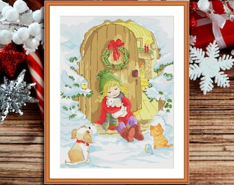 May include: A cross-stitch pattern featuring a girl in a red coat holding two white bunnies, a brown and white dog, and a ginger cat in a snowy winter scene. The girl is standing in front of a wooden door with a wreath on it.
