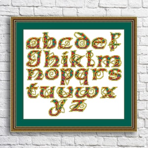 May include: A cross-stitch alphabet with a plaid pattern in red, green, and yellow. The letters are in a traditional font with decorative flourishes.